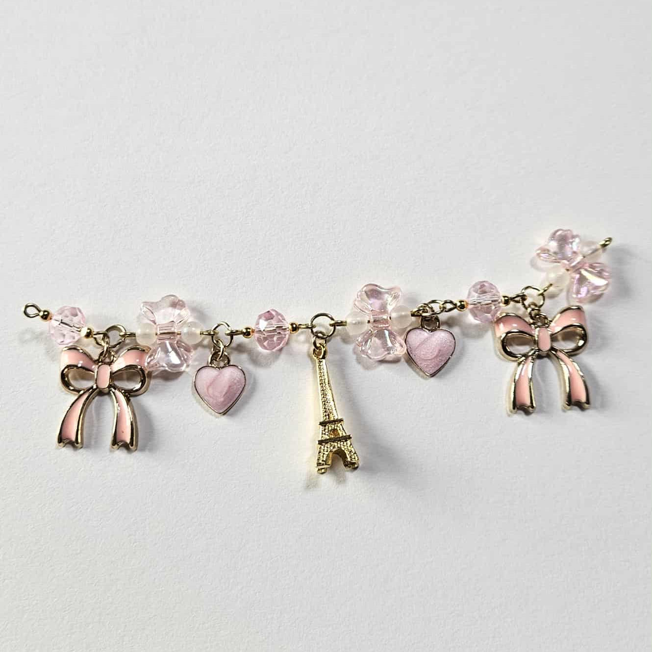 Pink Paris inspired charm bracelet gold-plated.